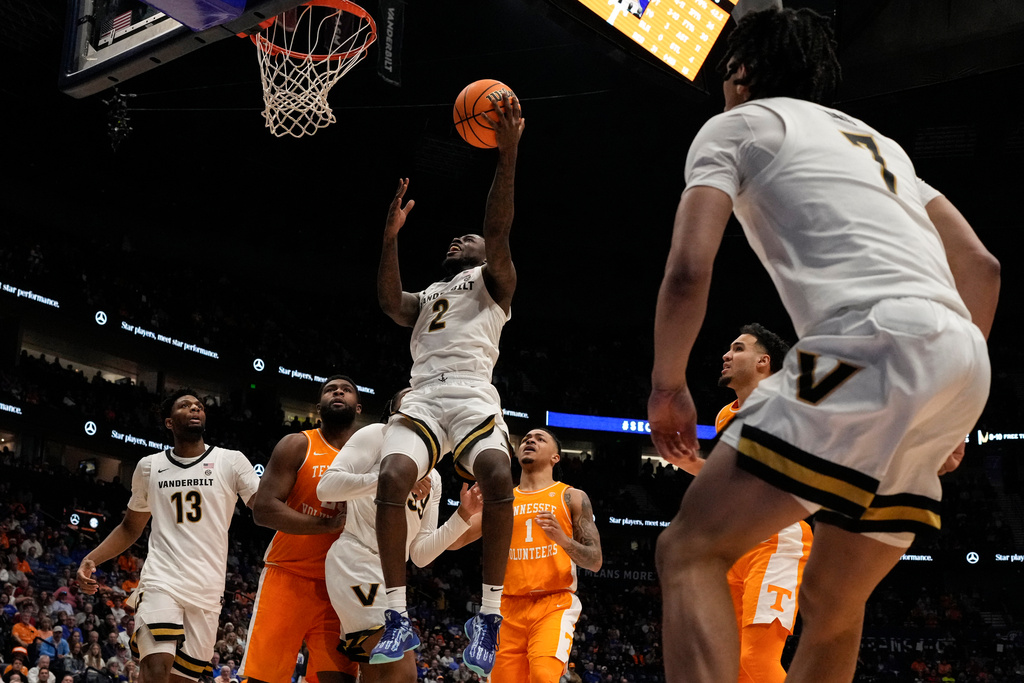 Vanderbilt guard Duke Miles (2) shoots against Tennessee during the second half of an NCAA college basketball game in the quarterfinal round of the Southeastern Conference tournament, Friday, March 13, 2026, in Nashville, Tenn. (AP Photo/George Walker IV)