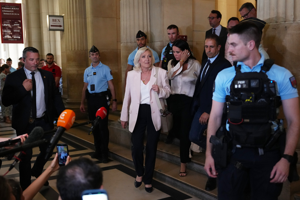 Far-right leader Marine Le Pen leaves the courtroom after the verdict of her appeal trial, in Paris, France, Tuesday, July. 7, 2026. (AP Photo/Aurelien Morissard)