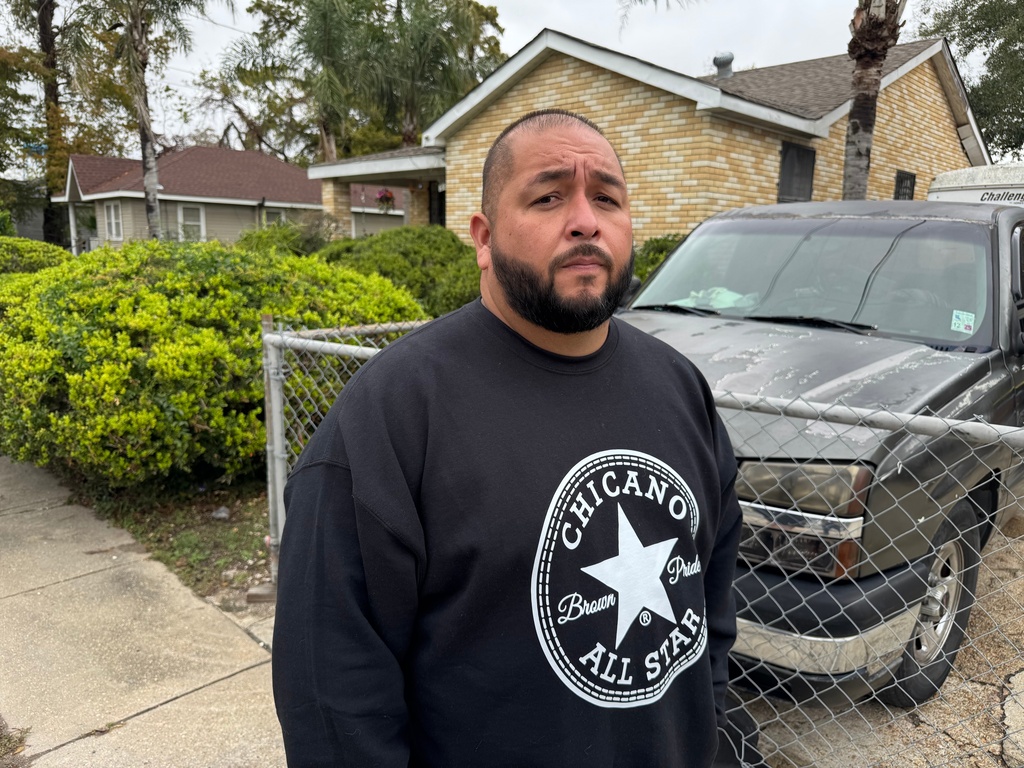 Juan Anglin, who watched federal agents chase his step-daughter Jacelynn Guzman, a 23-year-old U.S. citizen, as she was walking on the sidewalk, stands outside his home in Marrero, La., Thursday, Dec. 5, 2025. (AP Photo/Jack Brook)