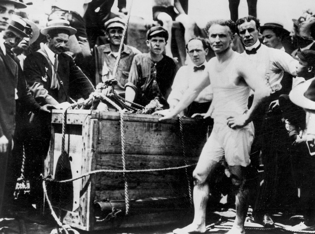 FILE - Escape artist Harry Houdini appears before being lowered in a packing crate into the ice-covered Detroit River in 1907. (AP Photo)