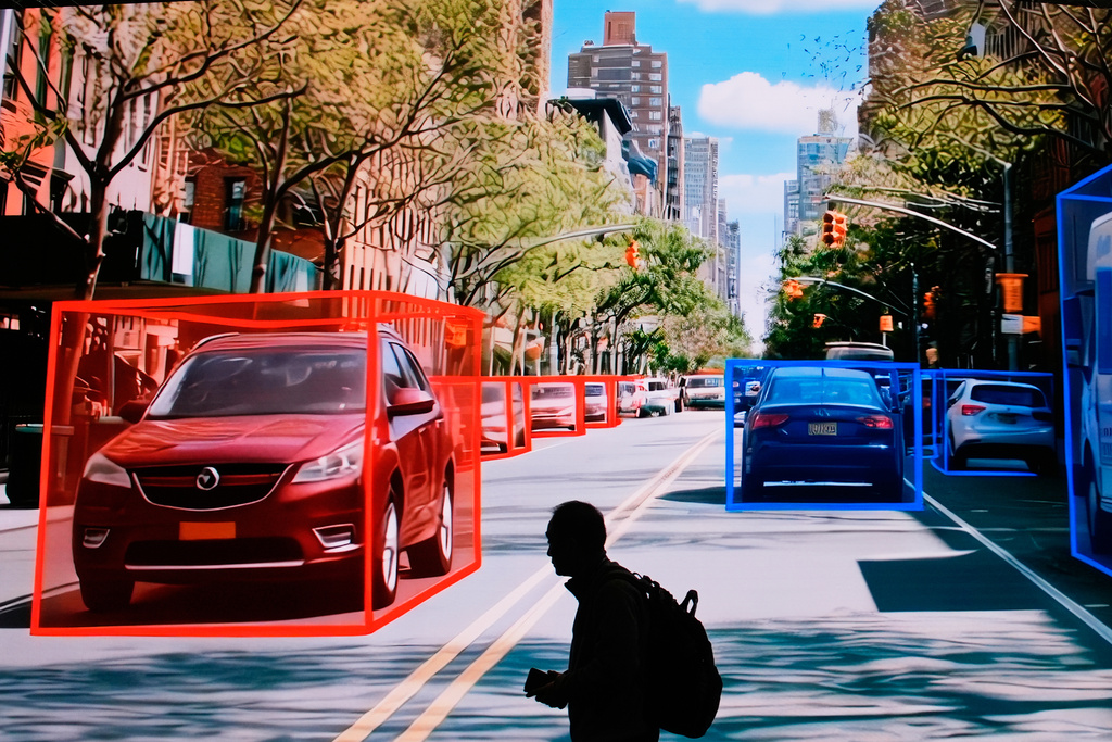 A person walks past a display for LG Innotek during the CES tech show Tuesday, Jan. 6, 2026, in Las Vegas. (AP Photo/John Locher)