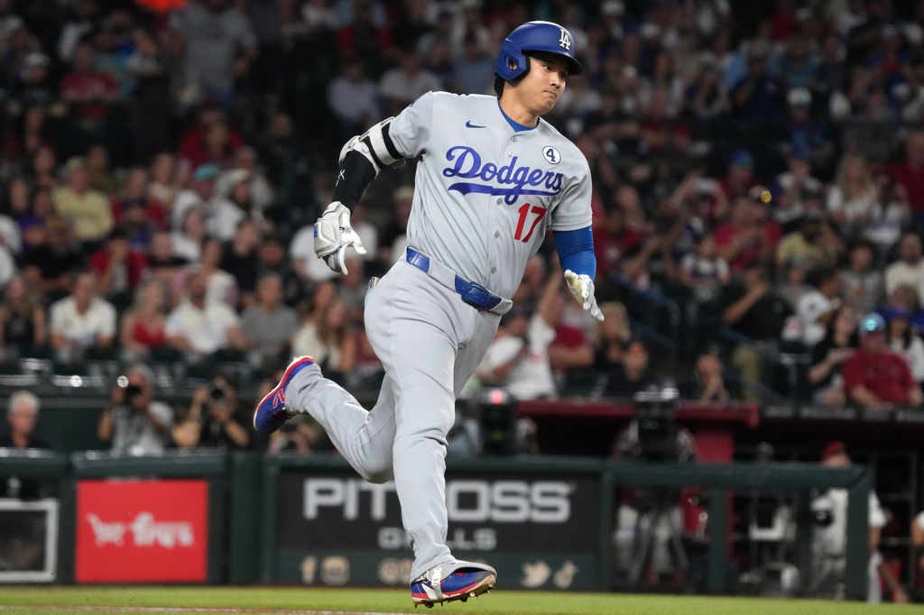 Los Angeles Dodgers' Shohei Ohtani hits a double against the Arizona Diamondbacks in the first inning of a baseball game, Tuesday, June 2, 2026, in Phoenix. (AP Photo/Rick Scuteri)