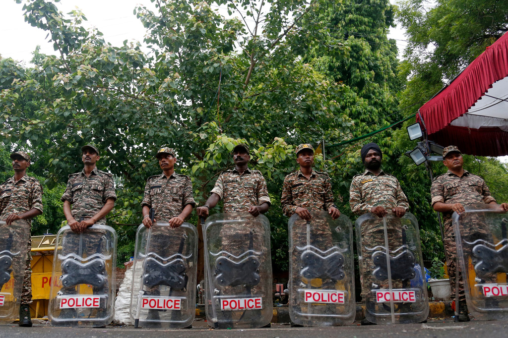 Security officers stand guard at the camping site of the Cockroach Janta Party at Jantar Mantar in New Delhi, Tuesday, July 21, 2026. (AP Photo/Shekhar Yadav)