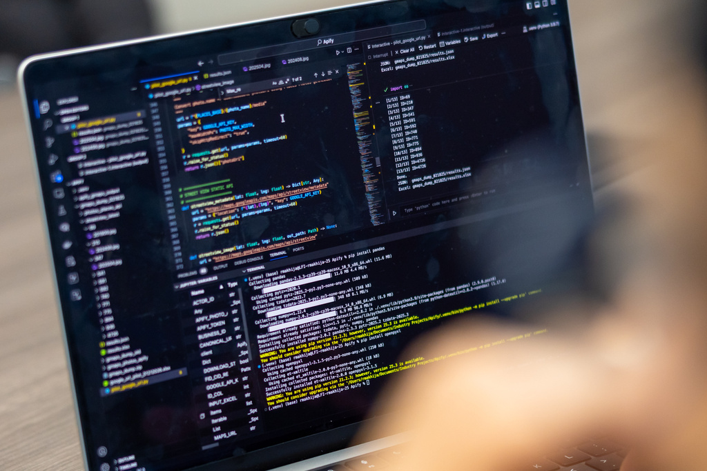 Programming used for an analysis of South Bend's 311 on a screen during a demonstration Thursday, Feb. 19, 2026, at City Hall in South Bend, Ind. (AP Photo/Michael Caterina)