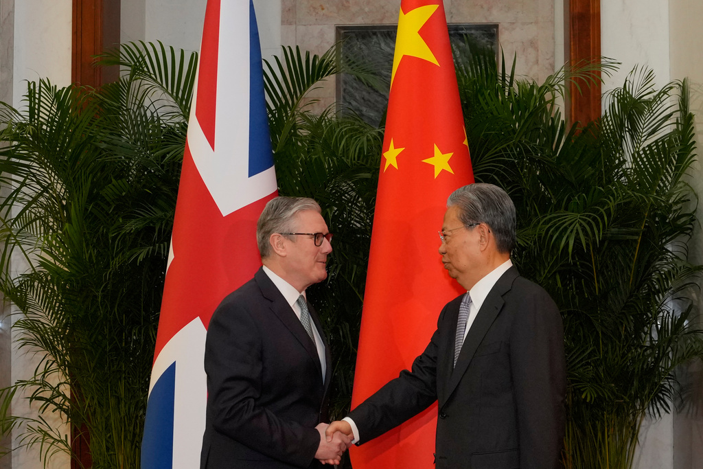 Britain's Prime Minister Keir Starmer, left shakes hands with National People's Congress Chairman Zhao Leji at the Great Hall of the People in Beijing, China, Thursday, Jan. 29, 2026. (AP Photo/Kin Cheung, Pool)