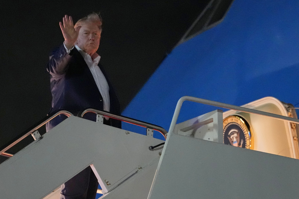 President Donald Trump waves as he boards Air Force One, Monday, June 15, 2026, at Joint Base Andrews, Md. (AP Photo/Julia Demaree Nikhinson)