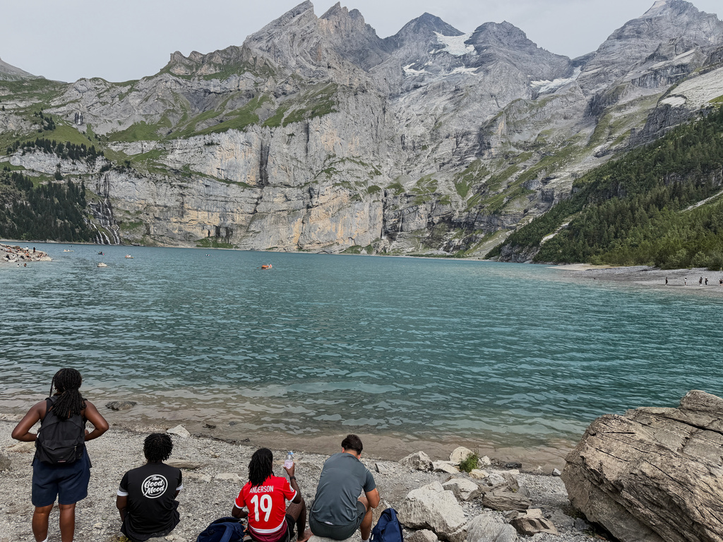 Tourists gather at the Oeschinensee lake near Kandersteg, Switzerland, Tuesday, Aug. 4, 2026. (AP Photo/Hernan Munoz)