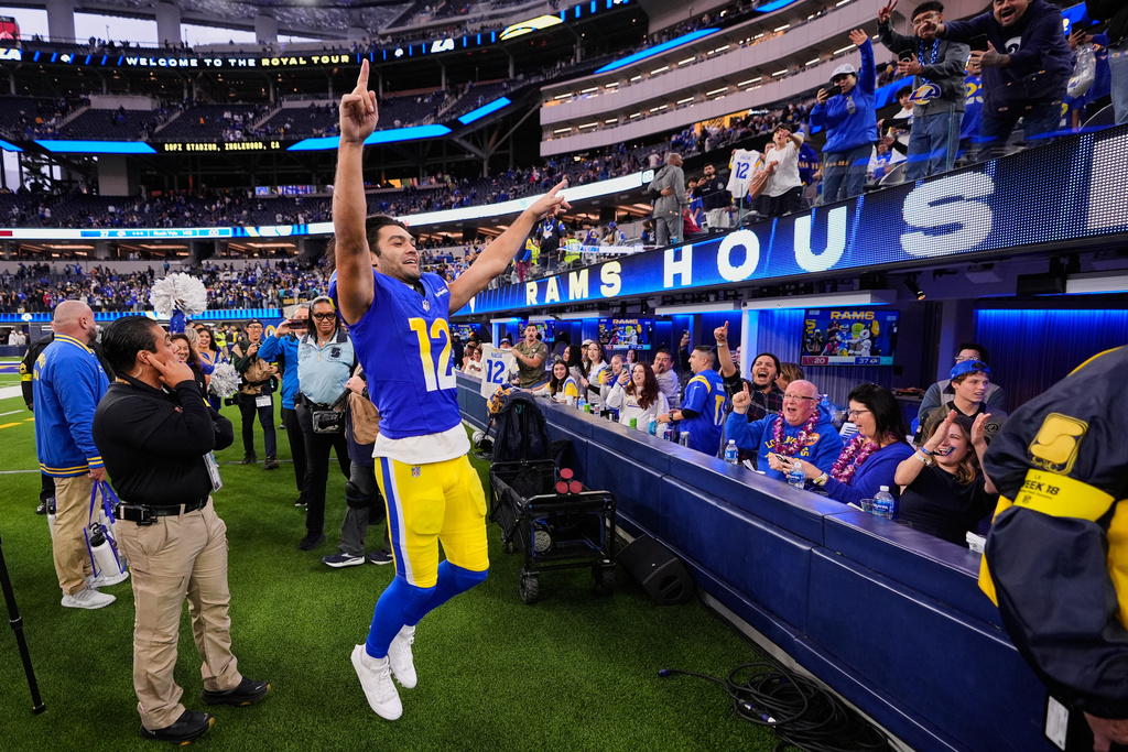 Los Angeles Rams wide receiver Puka Nacua (12) celebrates with fans as he exits the field following the team's victory over the Arizona Cardinals in an NFL football game, Sunday, Jan. 4, 2026, in Inglewood, Calif. (AP Photo/Mark J. Terrill)