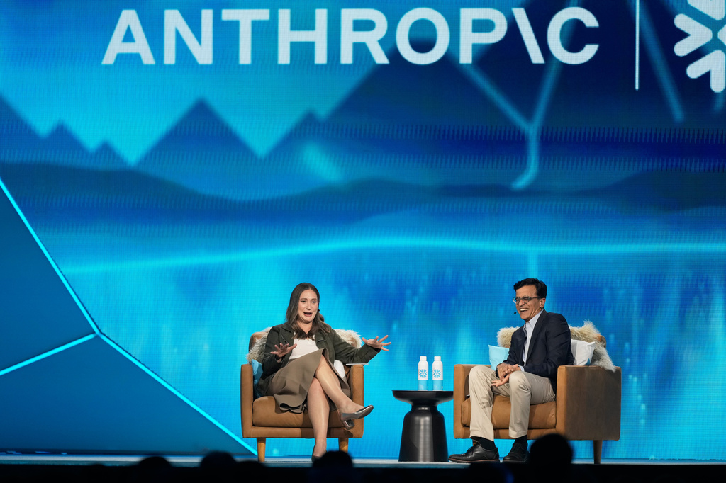 Anthropic co-founder and President Daniela Amodei, left, speaks with Snowflake CEO Sridhar Ramaswamy during the keynote presentaton at Snowflake Summit 26 Monday, June 1, 2026, in San Francisco. (AP Photo/Jeff Chiu)