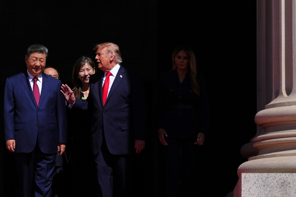 President Donald Trump, center, speaks with China's President Xi Jinping as first lady Melania Trump walks at right, at the National Archives Museum, Friday, Sept. 25, 2026, in Washington. (AP Photo/Julia Demaree Nikhinson)