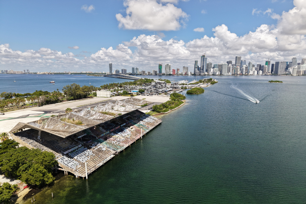 The Miami Marine Stadium, facing Biscayne Bay with the skyline in the background, is seen from an aerial view Tuesday Aug. 11, 2026, in Miami. (AP Photo/Daniel Kozin)