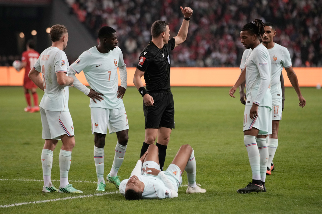 France's Kylian Mbappe lieas on the ground after he scored and injured himself during the UEFA Nations League soccer match between Turkey and France in Izmit, Turkey, Friday, Sept. 25, 2026. (AP Photo/Khalil Hamra)