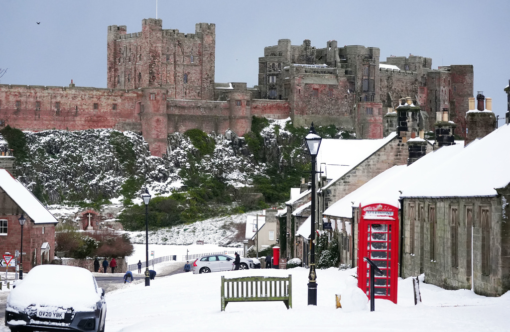 Bamburgh Castle surrounded by snow in Bamburgh, England, Tuesday, Jan. 6, 2026. (Owen Humphreys/PA via AP)