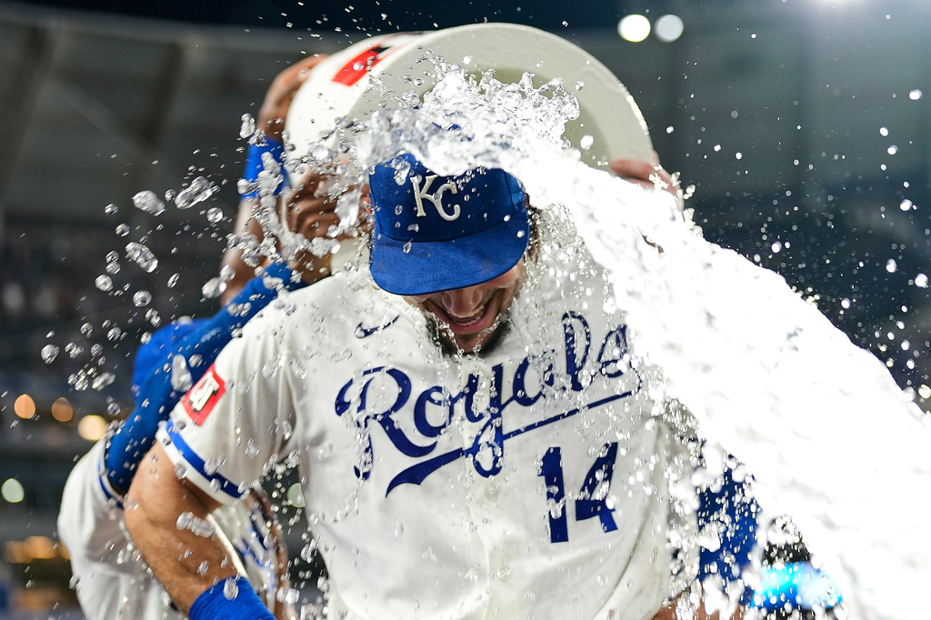 Kansas City Royals' Jac Caglianone is doused by teammates after their baseball game against the Texas Rangers, Tuesday, June 9, 2026, in Kansas City, Mo. (AP Photo/Charlie Riedel)