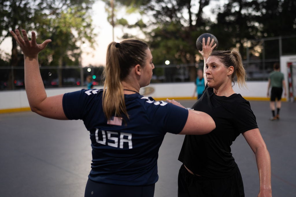 Jillana Darby Lee, right, works with coach Elizabeth Hartnett Wyatt during a handball training session in Tustin, Calif., Wednesday, March 25, 2026. (AP Photo/Jae C. Hong)
