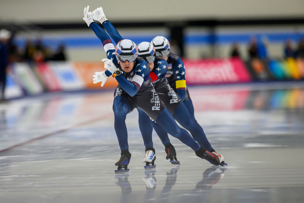 FILE - From front to back, United States' Casey Dawson, Emery Lehman and Ethan Cepuran skate to a new world record during the men's team pursuit at a World Cup speedskating event, Nov. 16, 2025, in Salt Lake City. (AP Photo/Tyler Tate, File)