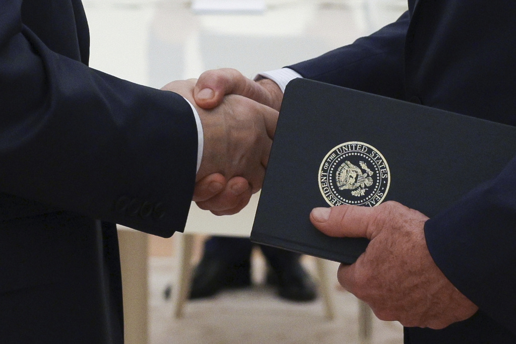 FILE - Russian President Vladimir Putin, left, and U.S. special envoy Steve Witkoff, right, shake hands during their meeting at the Kremlin in Moscow, Russia, Wednesday, Aug. 6, 2025. (Gavriil Grigorov, Sputnik, Kremlin Pool Photo via AP, File)