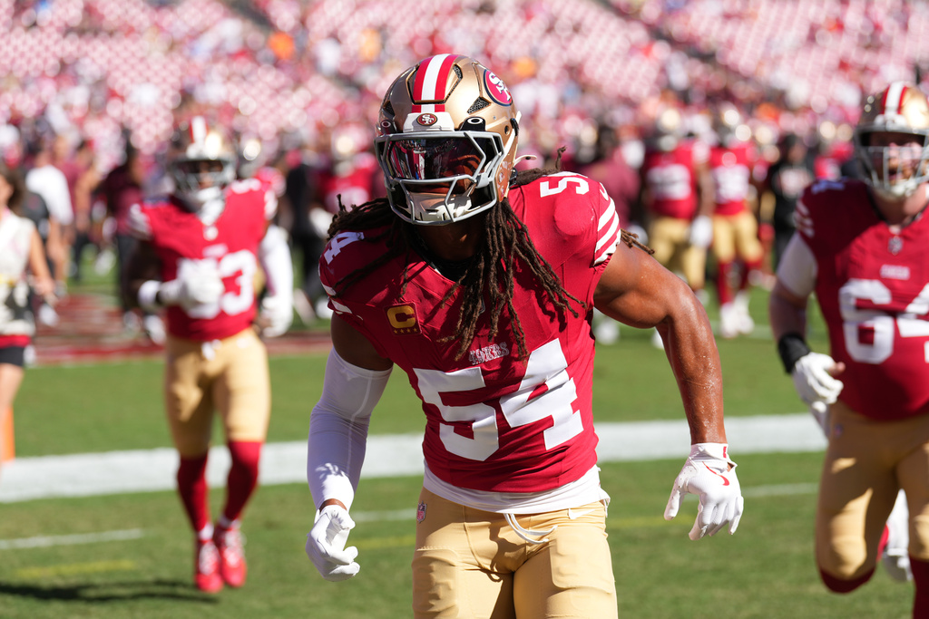 FILE - San Francisco 49ers middle linebacker Fred Warner (54) runs to the locker room after pregame warm-ups before an NFL football game against the Tampa Bay Buccaneers on Oct 12, 2025, in Tampa, Fla. (AP Photo/Peter Joneleit, File)