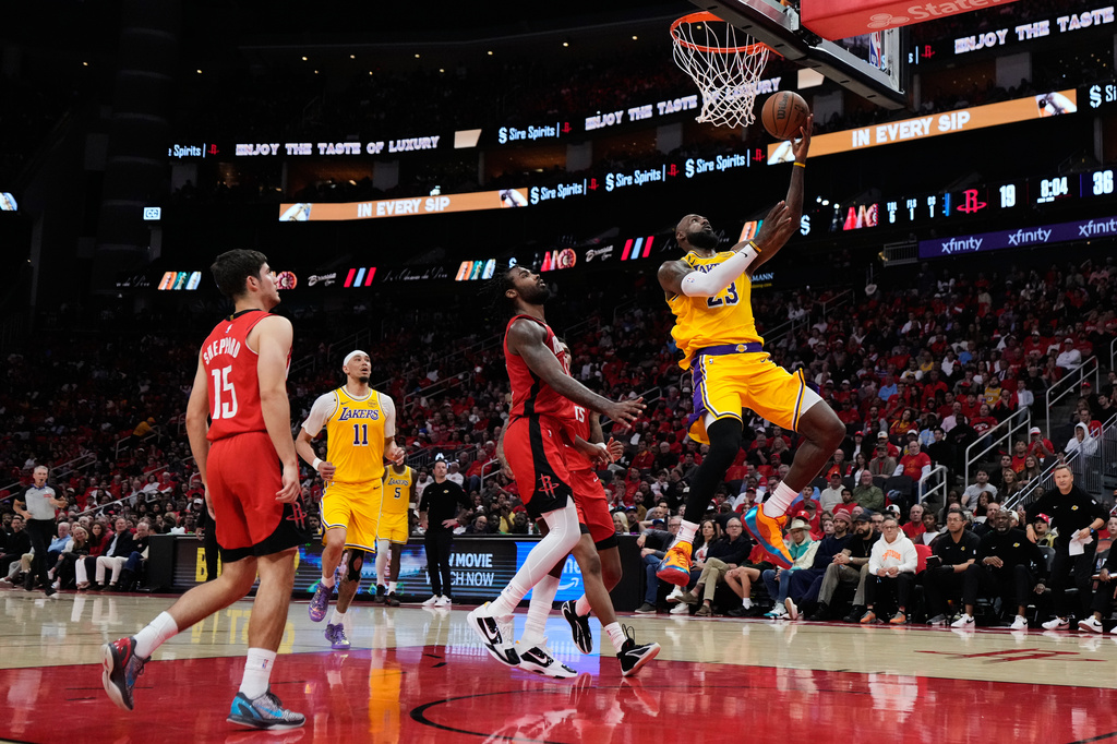 Los Angeles Lakers forward LeBron James (23) shoots during the first half of Game 6 of a first-round NBA playoffs basketball series against the Houston Rockets in Houston, Friday, May 1, 2026. (AP Photo/Ashley Landis)
