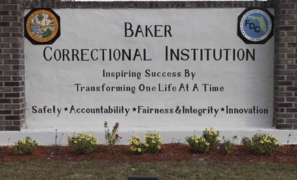 This undated image provided by the Florida Department of Corrections shows signage for the Baker Correctional Institution, a state prison about 43 miles (69 kilometers) west of downtown Jacksonville, Fla. (Florida Department of Corrections via AP)
