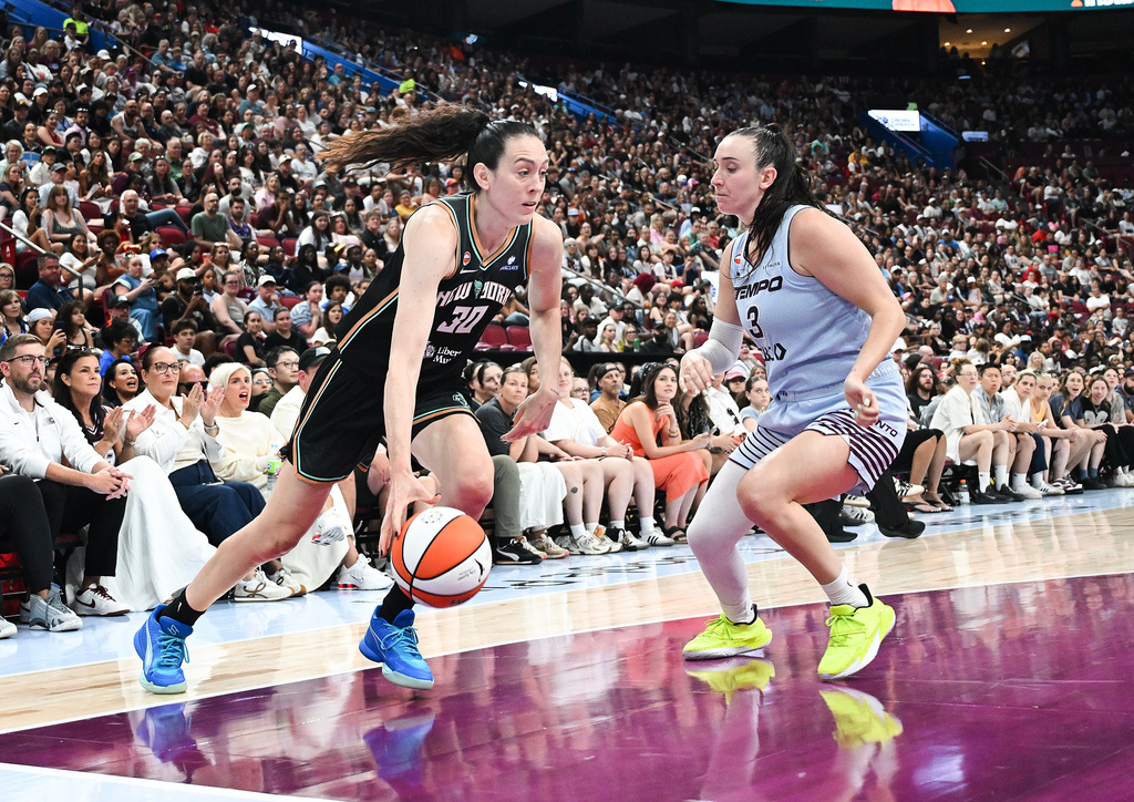 Toronto Tempo's Marina Mabrey (3) defends against New York Liberty's Breanna Stewart (30) as she drives to the basket during the second half of a WNBA basketball game in Montreal, on Sunday, July 12, 2026. (Graham Hughes/The Canadian Press via AP)