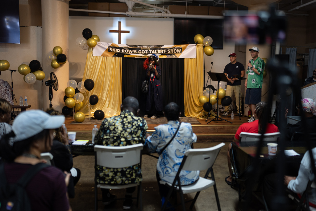 A contestant who goes by the nickname Queen Mussolini performs at Skid Row's inaugural talent show in downtown Los Angeles, Saturday, Sept. 19, 2026. (AP Photo/Jae C. Hong)