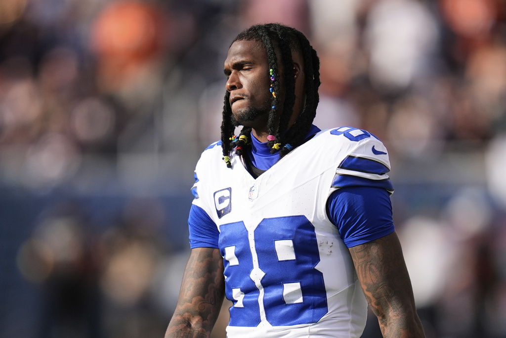 Dallas Cowboys wide receiver CeeDee Lamb walks along the sideline after suffering an unknown injury in the first half of an NFL football game against the Chicago Bears Sunday, Sept. 21, 2025, in Chicago. (AP Photo/Erin Hooley)