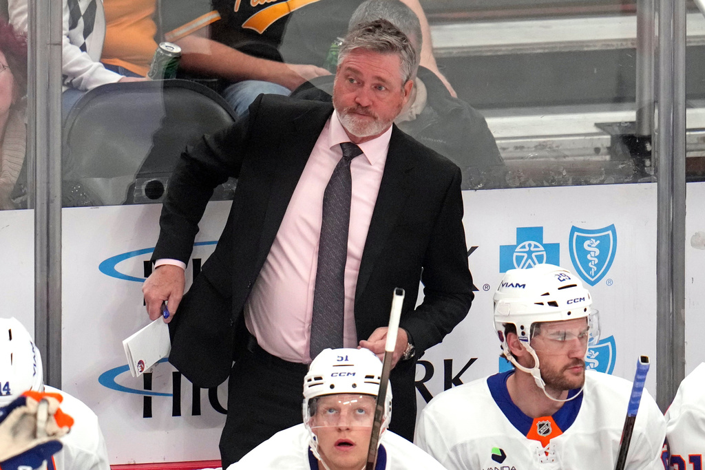 New York Islanders head coach Patrick Roy stands behind his bench during the first period of an NHL hockey game against the Pittsburgh Penguins in Pittsburgh, Thursday, Oct. 9, 2025. (AP Photo/Gene J. Puskar)
