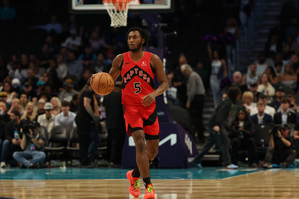 Toronto Raptors guard Immanuel Quickley (5) brings the ball up court during the first half of an NBA basketball game against the Charlotte Hornets, Wednesday, Jan. 7, 2026, in Charlotte, N.C. (AP Photo/Krista Jasso)