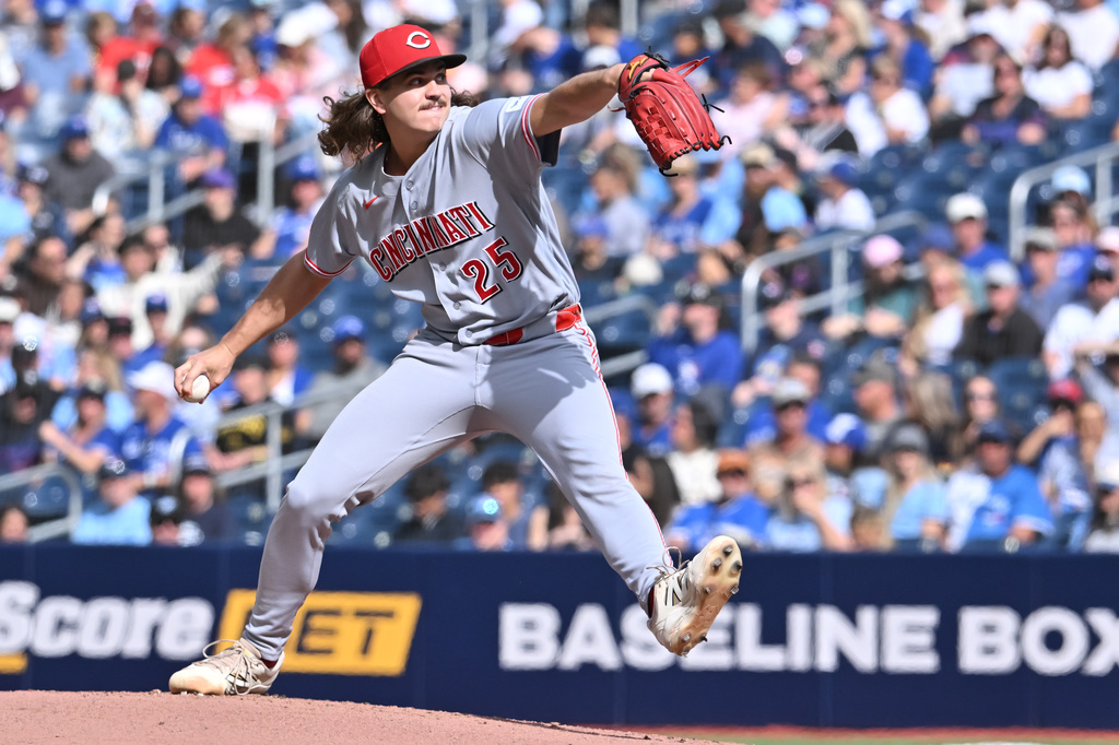 Cincinnati Reds starting pitcher Rhett Lowder (25) throws to a Toronto Blue Jays batter during the first inning of a baseball game in Toronto, Saturday, Sept. 26, 2026. (Jon Blacker/The Canadian Press via AP)