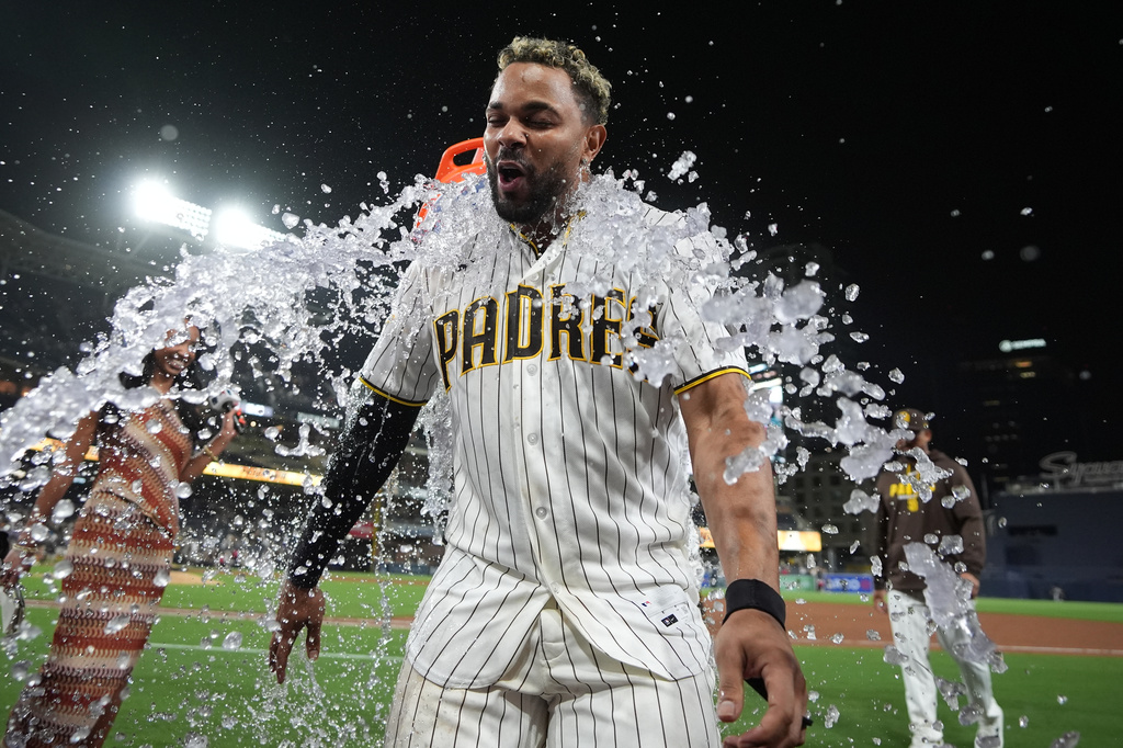 San Diego Padres' Xander Bogaerts celebrates after the Padres defeated the Colorado Rockies 8-7 in a baseball game Tuesday, July 28, 2026, in San Diego. (AP Photo/Gregory Bull)
