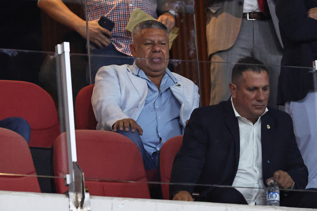 FILE - Claudio Tapia, president of Argentina's Soccer Association, back, attends to the Argentinian soccer league final match between Estudiantes de La Plata and Racing Club in Santiago del Estero, Argentina, Dec. 13, 2025. (AP Photo/Nicolas Aguilera, File)