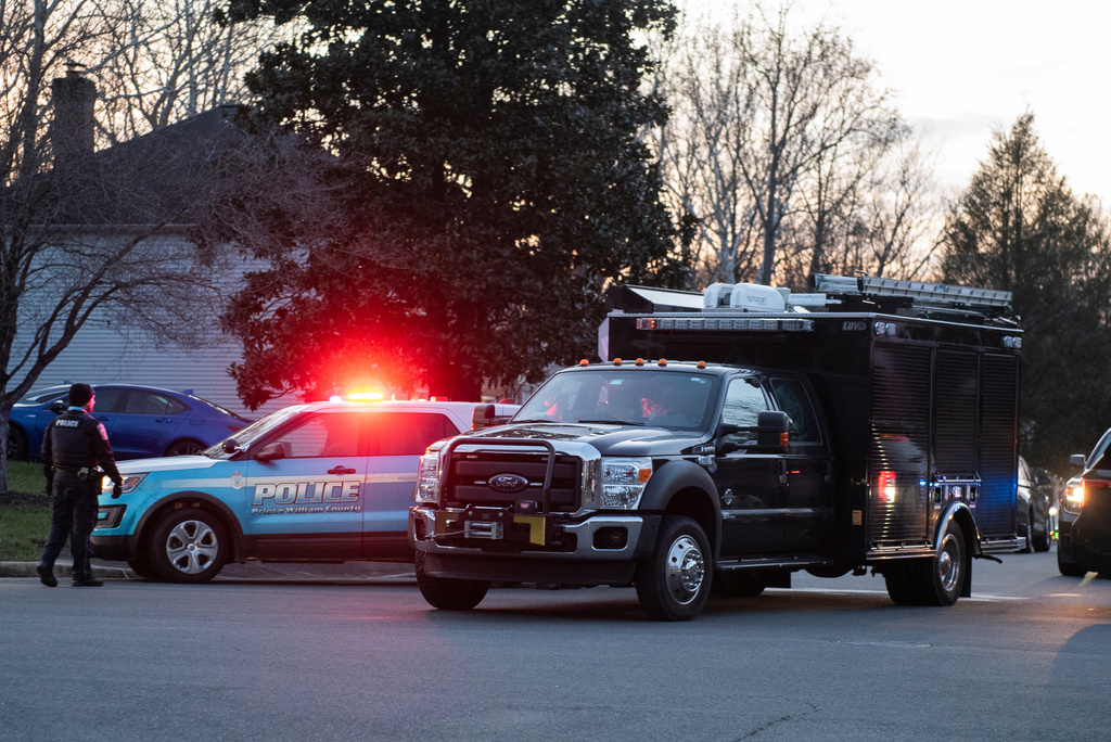 An FBI truck departs the street where the FBI made an arrest and are investigating a house in Woodbridge, Va., Thursday, Dec. 4, 2025. (AP Photo/Cliff Owen)