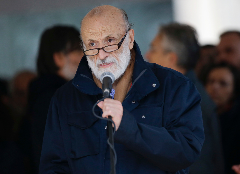 FILE -Slow Food movement founder Carlo Petrini speaks at the funeral of Italian playwright and 1997 Nobel for literature winner Dario Fo, outside Milan's Duomo gothic cathedral, Italy, Oct. 15, 2016. (AP Photo/Luca Bruno, File)