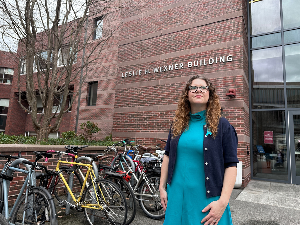 Lauren Barnes, a student in the Kennedy School's master's program, stands in front of the Leslie H. Wexner Building at Harvard University in Cambridge, Mass., on Wednesday, April 1, 2026. (AP Photos/Michael Casey)