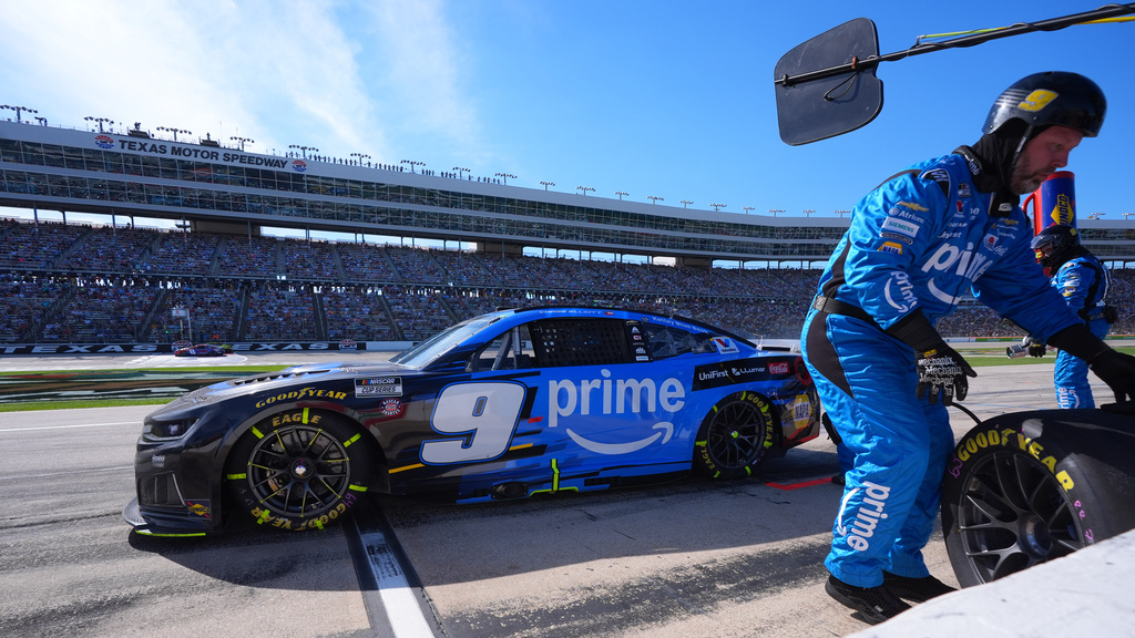 Chase Elliott drives out of a pit stop after a tire change during a NASCAR Cup Series auto race in Fort Worth, Texas, Sunday, May 3, 2026. (AP Photo/LM Otero)