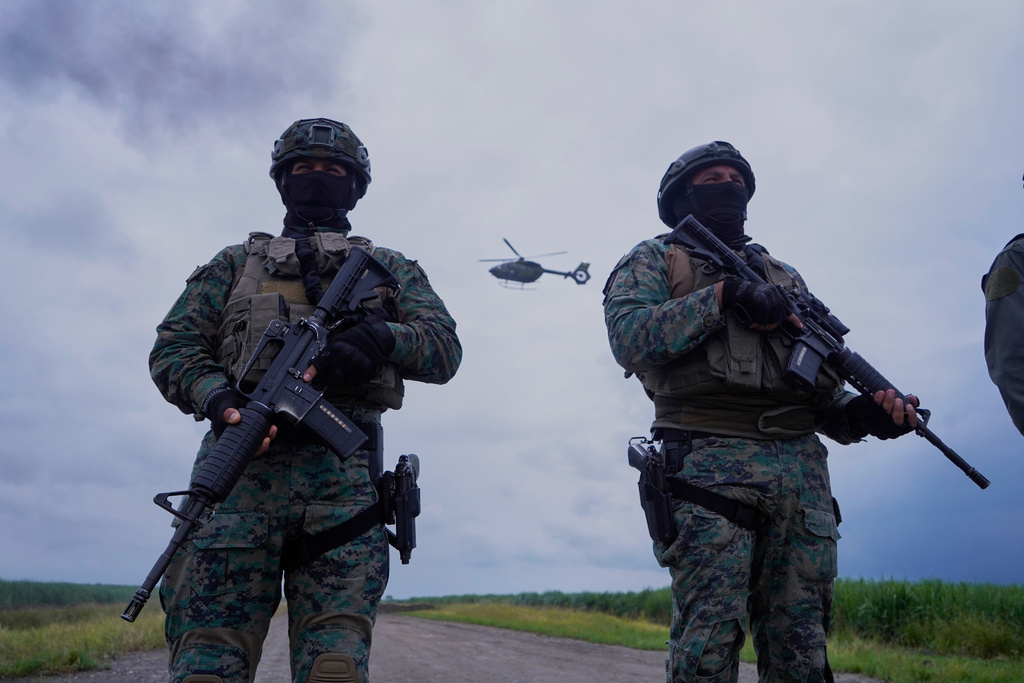 Air Force personnel destroy an airstrip they suspect to be in use by illicit aircrafts, in Milagro, Ecuador, Monday, March 16, 2026. (AP Photo/Cesar Muñoz)
