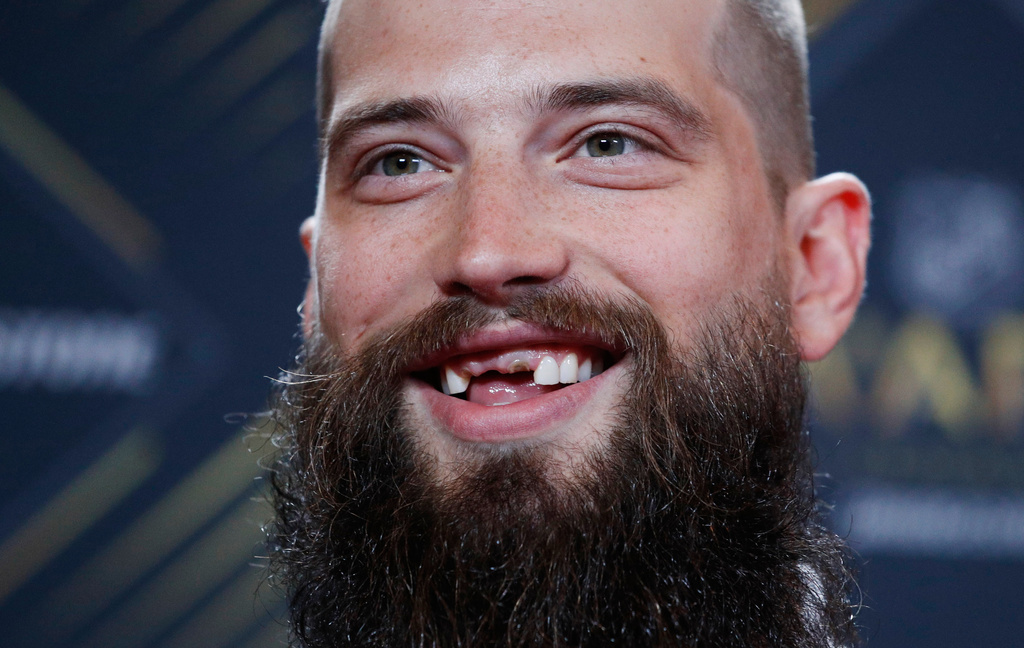 FILE - San Jose Sharks' Brent Burns smiles on the red carpet before the NHL Awards, Wednesday, June 19, 2019, in Las Vegas. (AP Photo/John Locher, File)