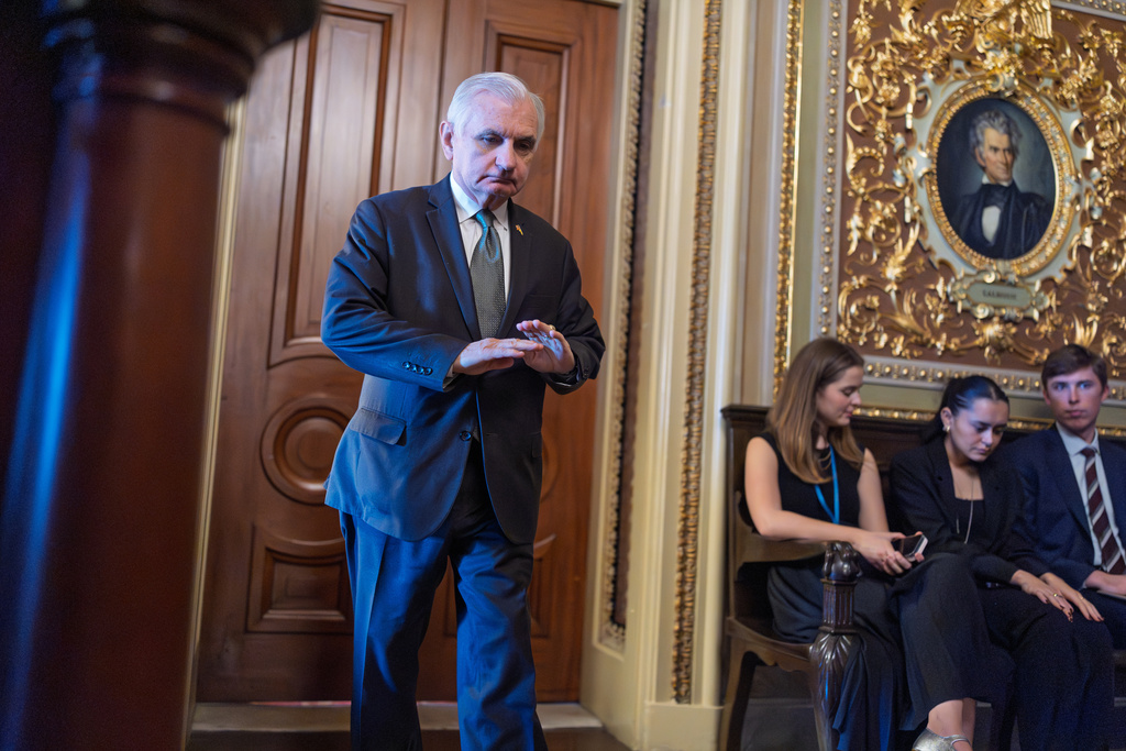 Sen. Jack Reed, D-R.I., leaves a meeting room where he and other Senate Democrats at the Capitol are looking for a solution to the spending impasse, in Washington, Thursday, Nov. 6, 2025, day 37 of the government shutdown. (AP Photo/J. Scott Applewhite)