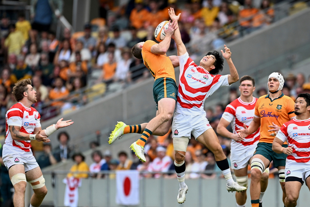 Harry Potter of Australia competes with Yoshitaka Yazaki of Japan for the ball during a rugby international between Japan and Australia in Townsville, Australia, Saturday, Aug. 15, 2026. (Dave Hunt/AAPImage via AP)