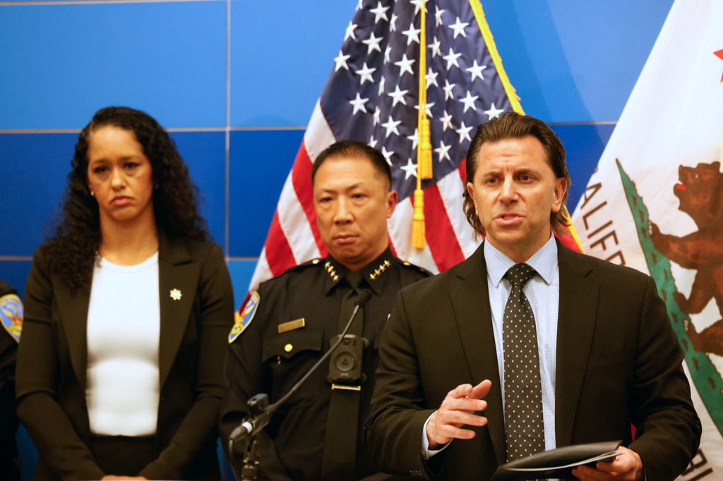 Matt Cobo, F.B.I. San Francisco Acting Special Agent in Charge, right, speaks next to San Francisco Police Chief Derrick Lew during a news conference, Monday, April 13, 2026, in San Francisco. (Lea Suzuki/San Francisco Chronicle via AP)