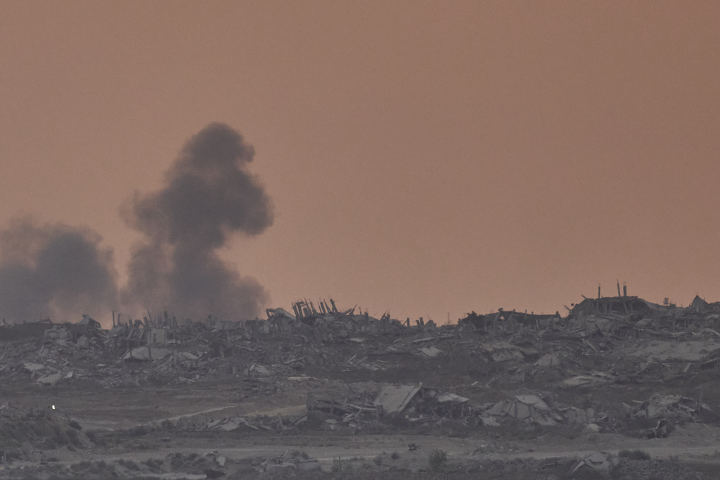 Smoke rises following an explosion in the Gaza Strip, as seen from southern Israel, Sunday, Aug. 10, 2025. (AP Photo/Ohad Zwigenberg)