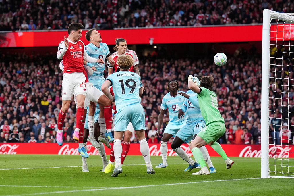 Arsenal's Kai Havertz, left, scores their side's first goal during the English Premier League soccer match between Arsenal and Burnley in London, Monday May 18, 2026. (John Walton/PA via AP)