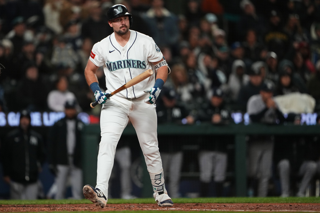 Seattle Mariners' Cal Raleigh reacts after striking out against the New York Yankees during the seventh inning of a baseball game, Monday, March 30, 2026, in Seattle. (AP Photo/Lindsey Wasson)