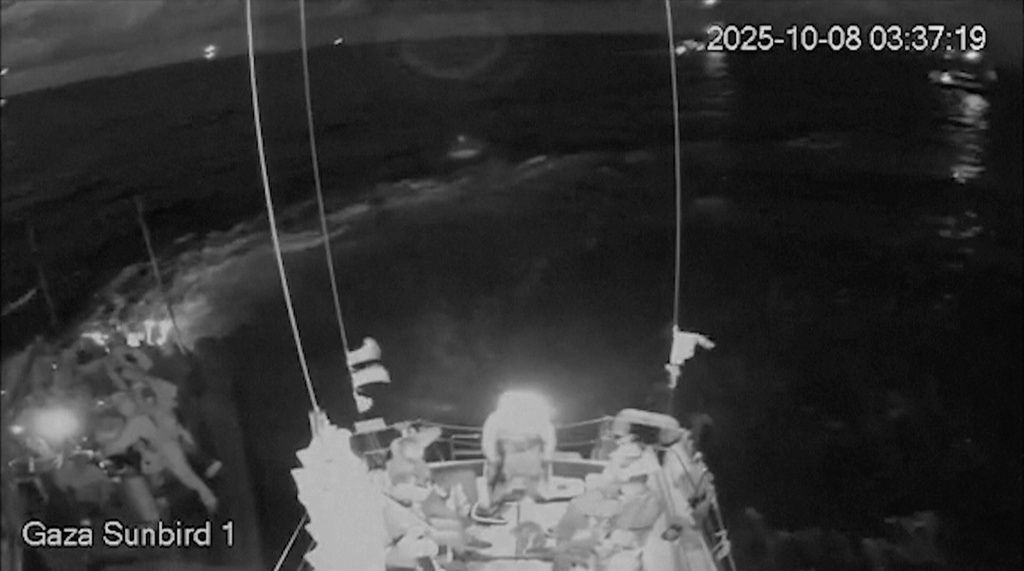 This image obtained from live stream footage from Gaza Sunbird vessel, one of the nine boats taking part in the Freedom Flotilla Coalition & Thousand Madleens to Gaza, shows Israeli forces approaching in boats, in Eastern Mediterranean sea, on Wednesday, Oct. 8, 2025. (Freedom Flotilla Coalition via AP)