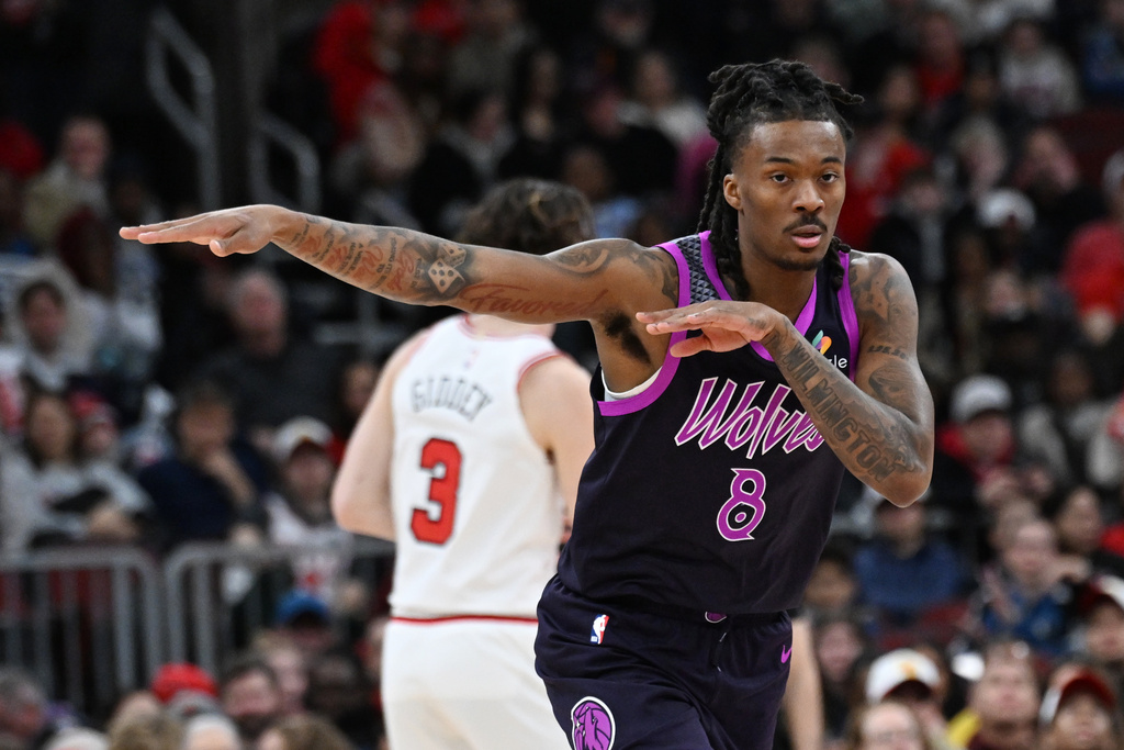 Minnesota Timberwolves' Bones Hyland (8) celebrates after making a 3-point basket during the first half of an NBA basketball game against the Chicago Bulls, Monday, Dec. 29, 2025, in Chicago. (AP Photo/Paul Beaty)
