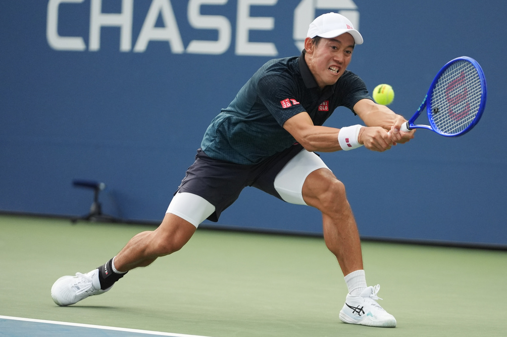 Kei Nishikori, of Japan, returns the ball to Michael Antonius, of the United States, during a qualifying match at the U.S. Open tennis championships Wednesday, Aug. 26, 2026, in New York. (AP Photo/Frank Franklin II)