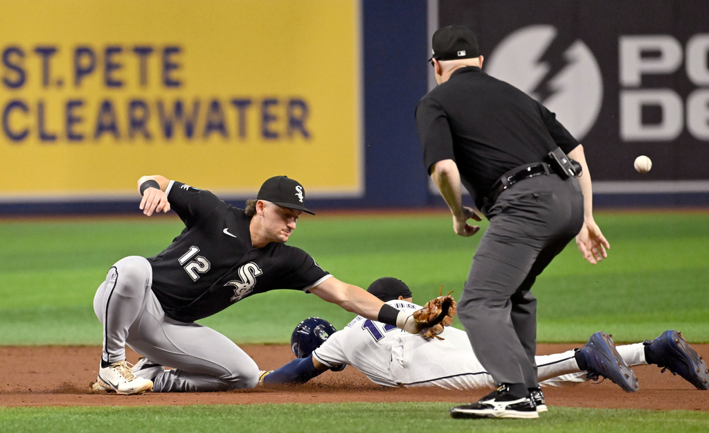 Tampa Bay Rays's Chandler Simpson (14) steals second as the throw gets away from Chicago White Sox shortstop Colson Montgomery (12) during the fourth inning of a baseball game Friday, July 31, 2026, in St. Petersburg, Fla. (AP Photo/Jason Behnken)