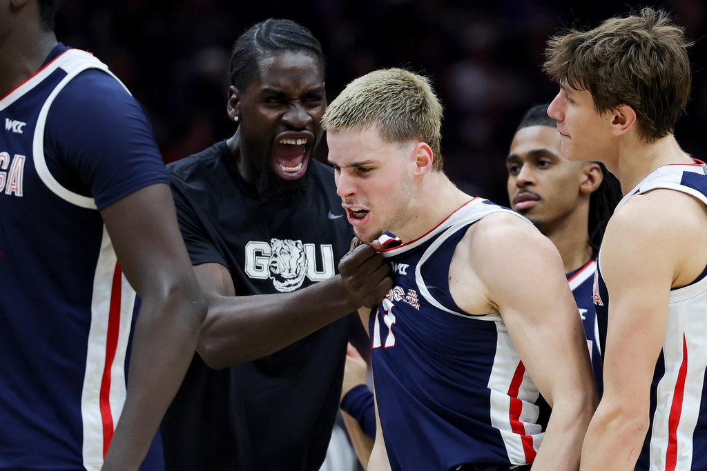 Gonzaga guard Mario Saint-Supery, right, celebrates with forward Graham Ike during a timeout during the second half of an NCAA college basketball game against Seattle University Saturday, Jan. 17, 2026, in Seattle. (AP Photo/Ryan Sun)