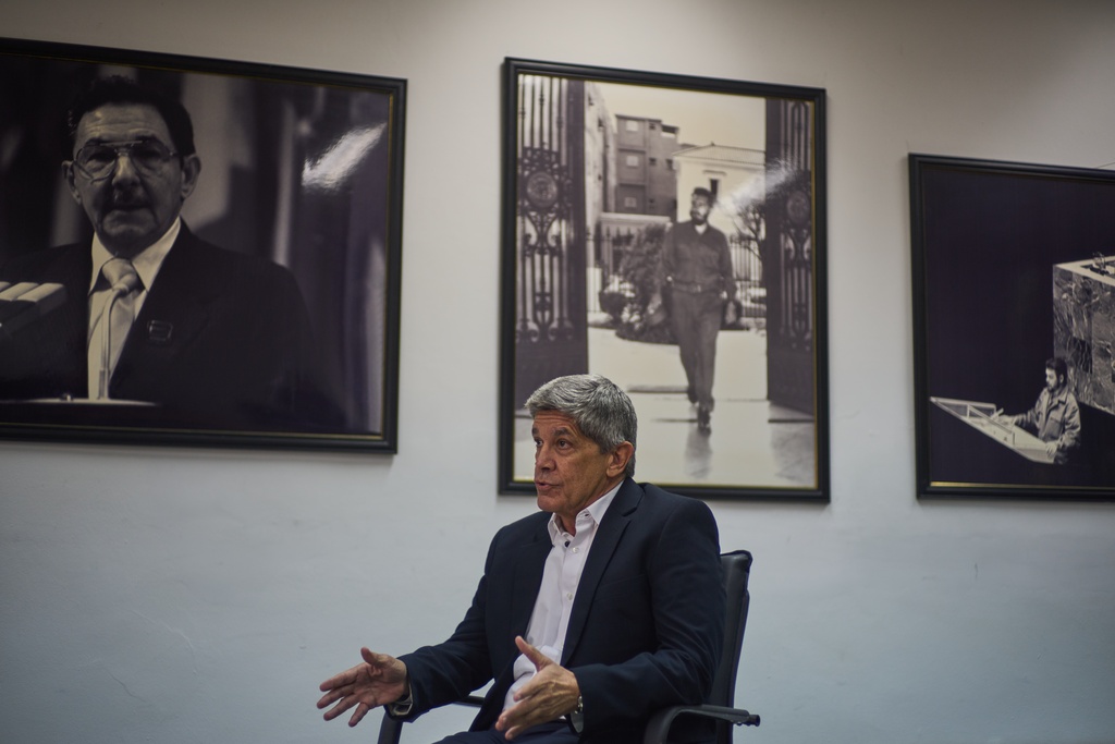 Cuban Deputy Foreign Minister Carlos Fernandez de Cossio gives an interview in front of images of Raul Castro, Fidel castro and Che Guevara, at the Foreign Ministry in Havana, Cuba, Monday, Feb. 2, 2026. (AP Photo/Ramon Espinosa)